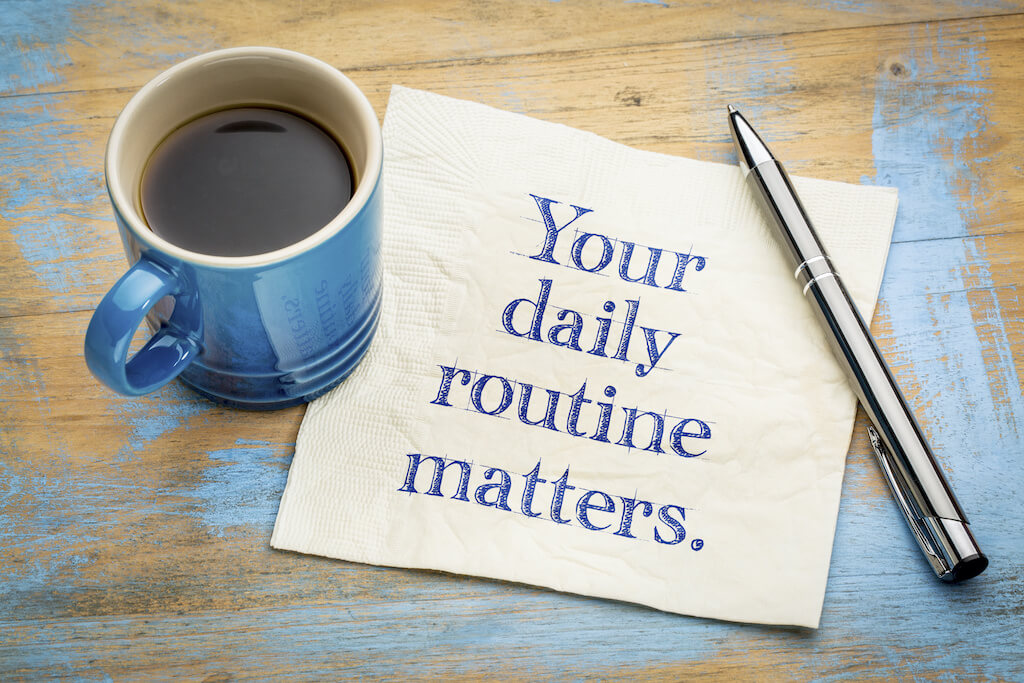 Coffee cup, pen, napkin with writing