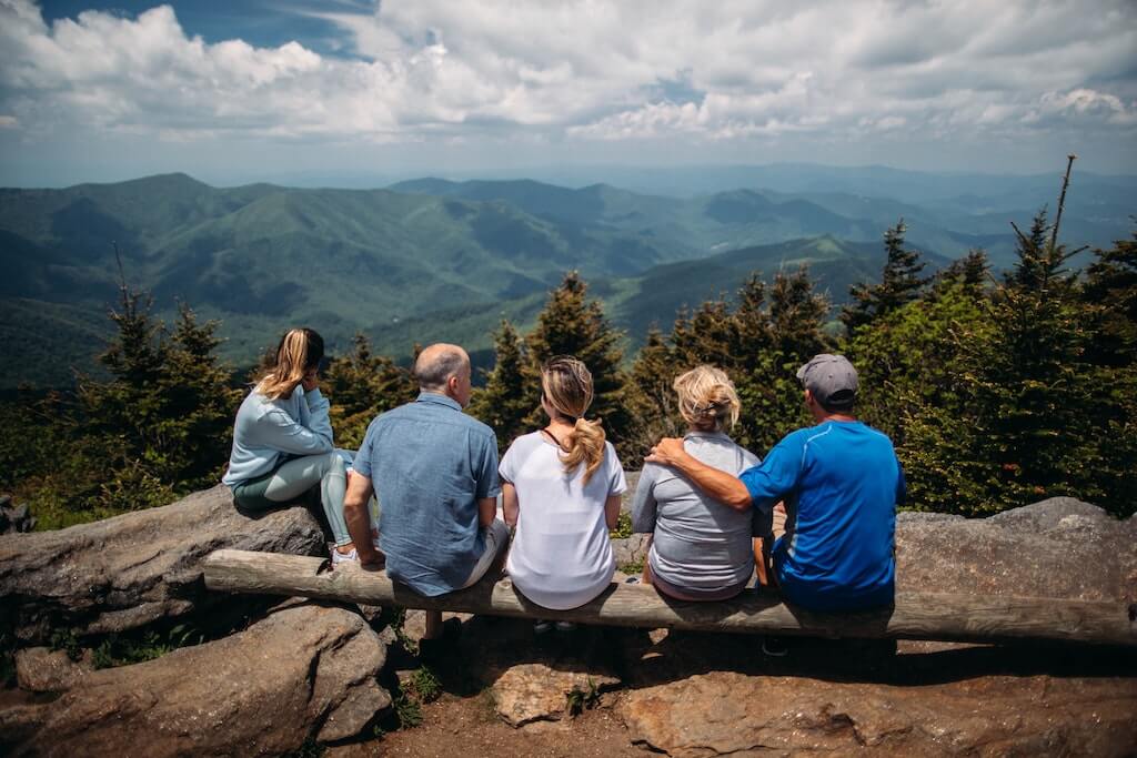 Family sitting on mountain