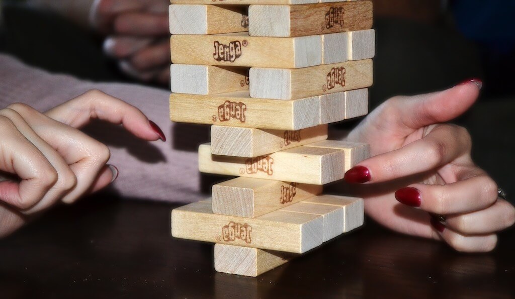 Jenga puzzle about to topple