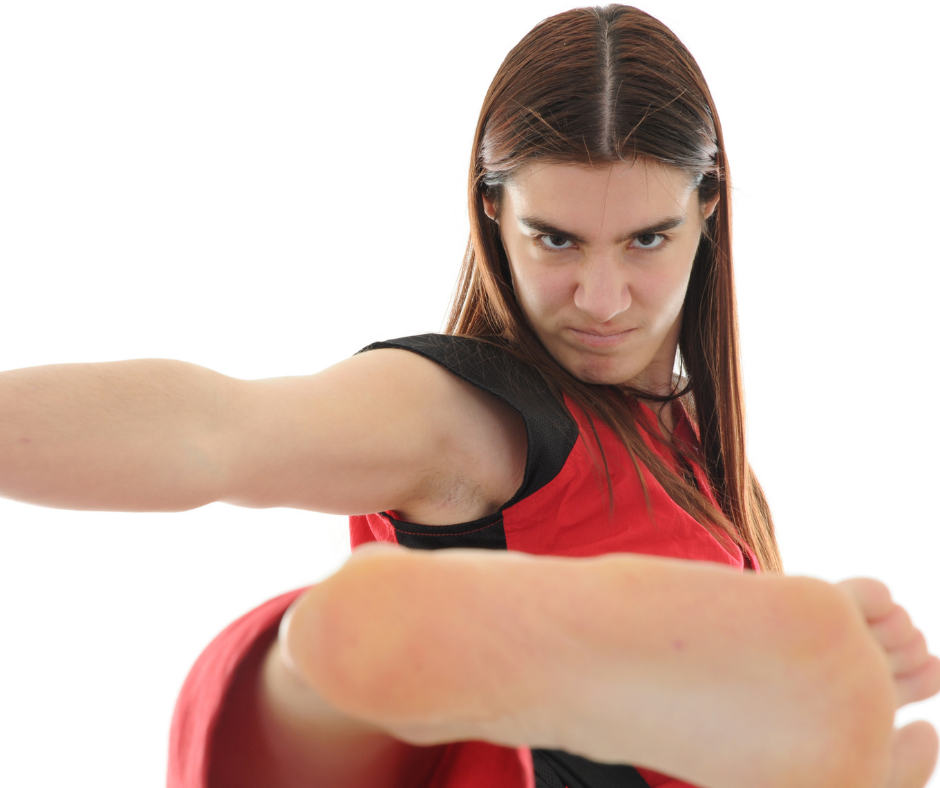 Woman facing off hopelessness using a karate kick